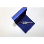 An antique 9ct gold & moonstone bar brooch