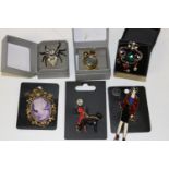 Six boxed costume jewellery brooches
