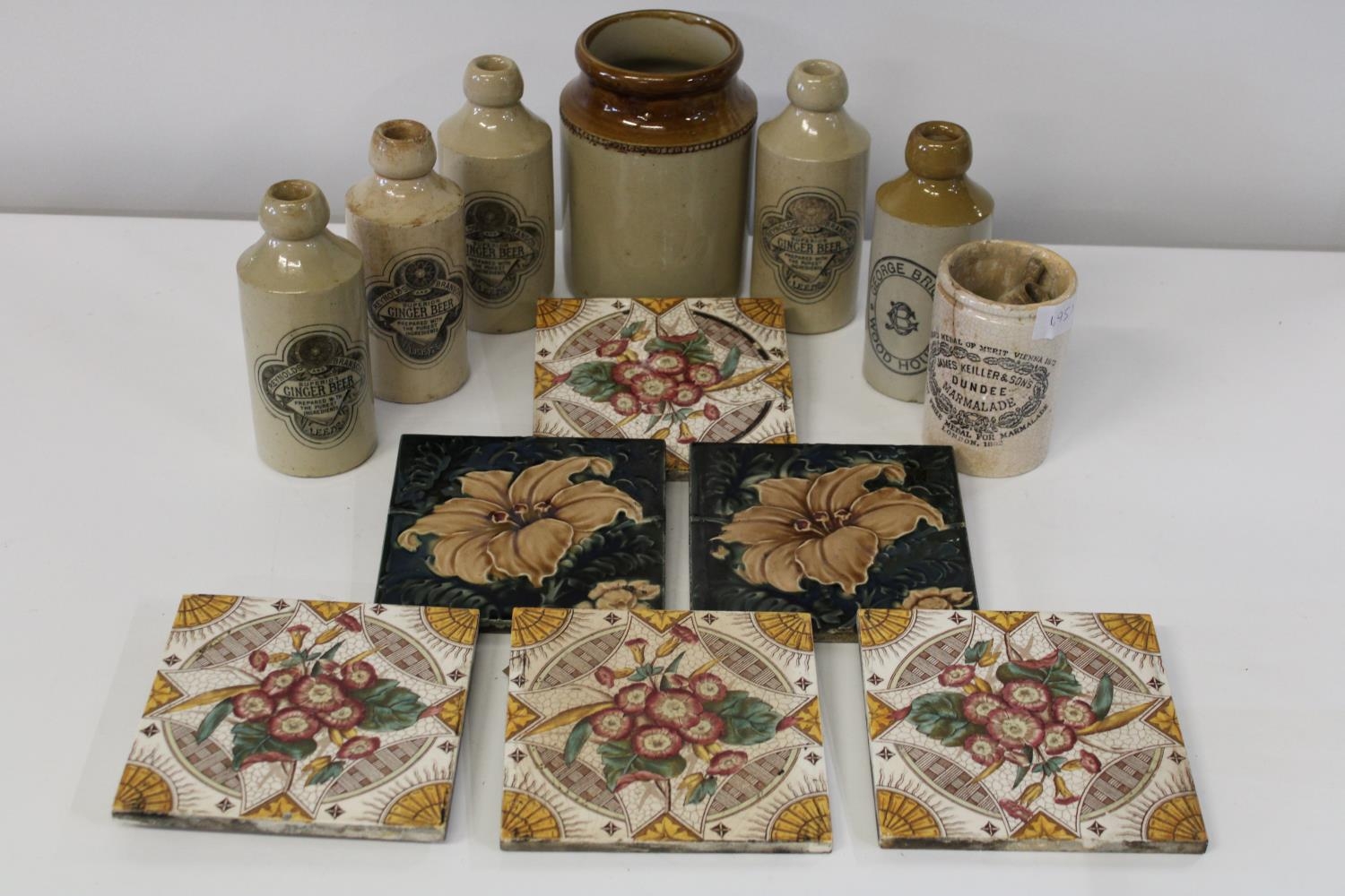 A selection of antique stoneware bottles & tiles