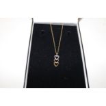 A 9ct gold triple heart pendant & chain