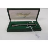 A boxed Davidoff cigar cuter in it's original fitted case