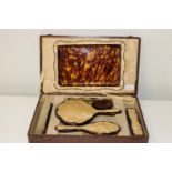 A vintage cased tortoise shell effect Ladies dressing table set