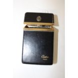 A Cartier black leather cigarette case, sized to accept a regular cigarette packet 11x6cm