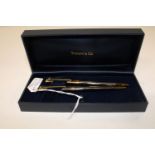 A boxed Tiffany & Co pen & pencil set in the original box