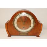 A vintage wooden mantel clock