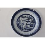 A Chinese flow blue bowl. Sold as seen d22cm