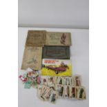A collection of loose stamps & cigarette cards & albums
