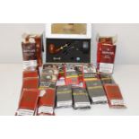 A large job lot of pipe tobacco with an electronic pipe