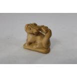 A Chinese box wood netsuke