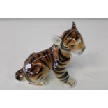 A Russian tiger cub figure 13x17cm