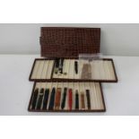 A Gucci watchmakers case with Gucci watch straps 16 in total. Mostly new & unused along with misc