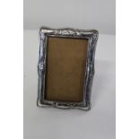 An Art Nouveau period hallmarked silver photo frame 17x12cm