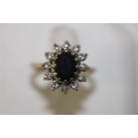 A 9ct gold sapphire & diamond cluster ring size N