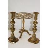 A brass trivet on stand & pair of antique brass candlesticks