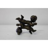 A bronze co-joined crawling babies figure 10x10cm