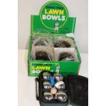 A set of four vintage lawn bowls & set of French boules