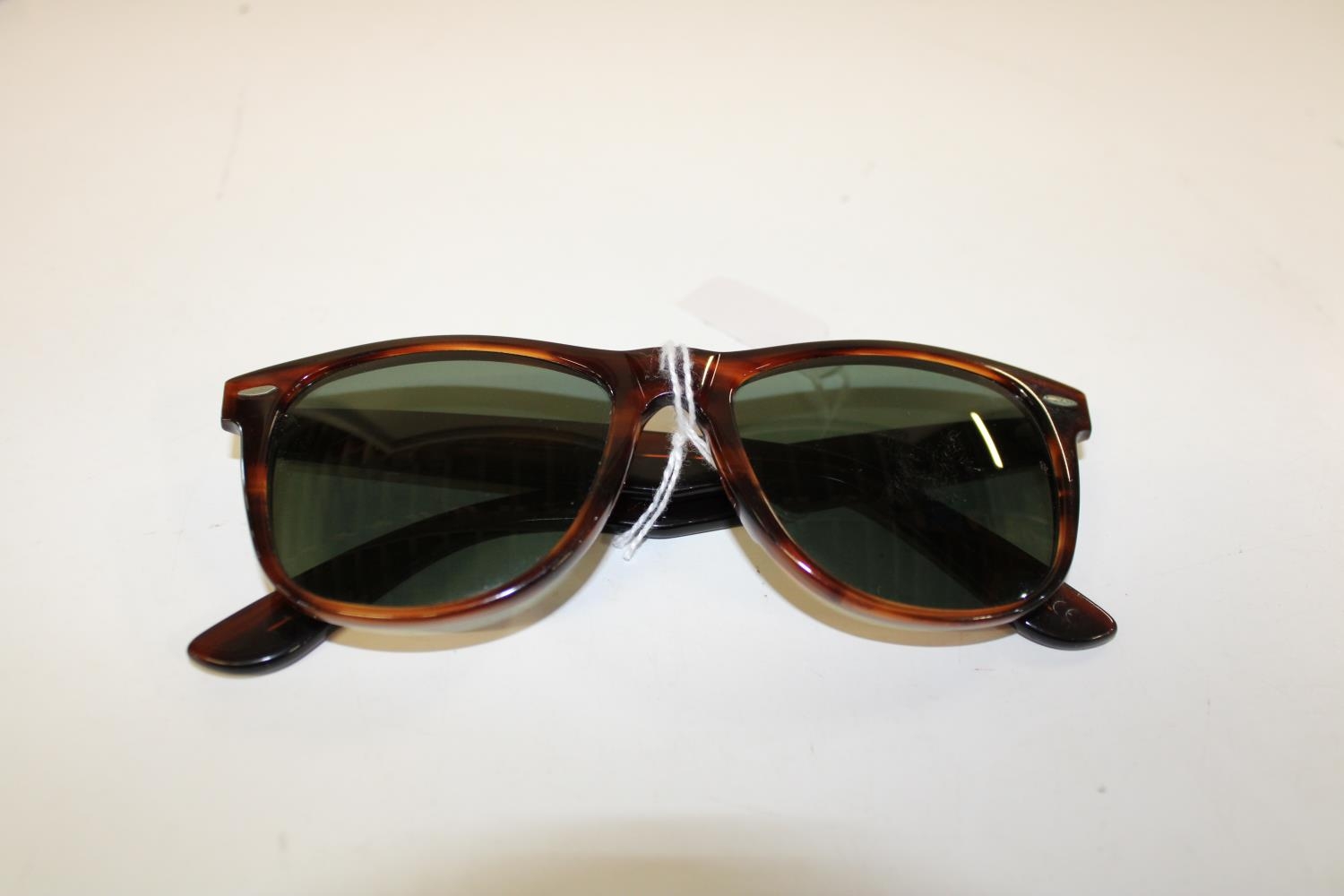 A pair of original Ray Ban tortoise shell Wayfarers II Baush & Lomb lenses with etchings