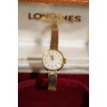 A antique Longines Ladies 9ct gold wrist watch in the original box