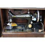 A cased Singer manual sewing machine Collection Only