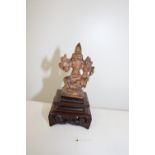 A Chinese Tibetan bronze & copper Buddha on a carved wooden stand total h10cm