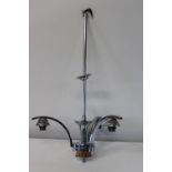 An Art Deco period chromed ceiling light with bakelite insert Height 61cm