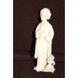 An antique carved ivory immortal figure signed to the base H15cm tall
