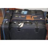 A large selection of usable luggage some new with tags all with 2 wheels