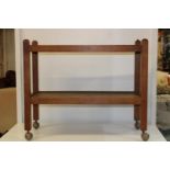 An original Robert (mouseman) Thompson 1950's early 1960's oak tea trolley, with trademark carved