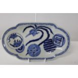 An unusual 18th century Chinese platter, decorated with a peacock & circular motives, with mark to