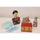 A box of misc items including vintage money boxes etc