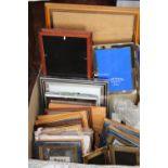 A box full of assorted picture frames etc