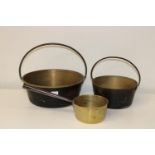 Three assorted antique brass pans