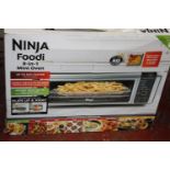 A new boxed 8 in 1 mini oven