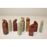 Nine Chinese soap stone animal figures in various colours