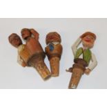 Three antique novelty articulated wooden bottle stoppers