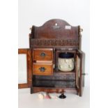 A quality Edwardian smokers cabinet & contents 49cm tall