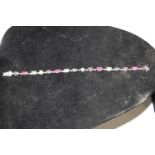 A .925 bracelet with paste mixed gemstones