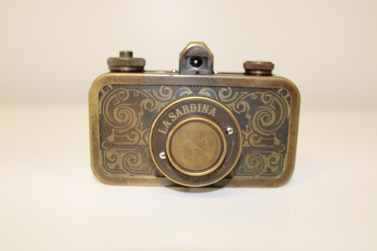A vintage La Sardina camera in a brass bound case