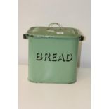 A vintage green enamelled bread bin