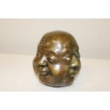 A bronze four faces of Buddha figure with marks to the base h12cm