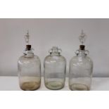 Three glass demijohn's