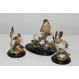 Three hand decorated 'Country Artists' figurines