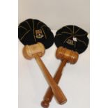 Two wooden mallets & two vintage school caps