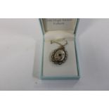 A hallmarked silver locket & chain