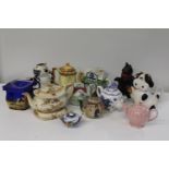 A box full of collectable tea pots (sold as seen) collection only