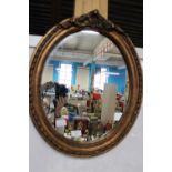 An antique gilt framed mirror 57cm x 46cm collection only