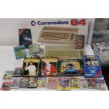 A Commodore 64 console (no cables) and selection of games