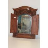 A quality hand carved wooden wall mirror with doors 70x63 Collection only