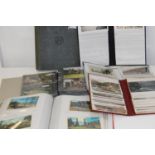 A selection of full postcard albums and one empty vintage album
