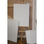 A new artists easel & collection of new canvases Collection only